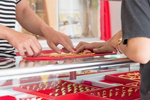 Pawnshop service counter with customer transaction in progress