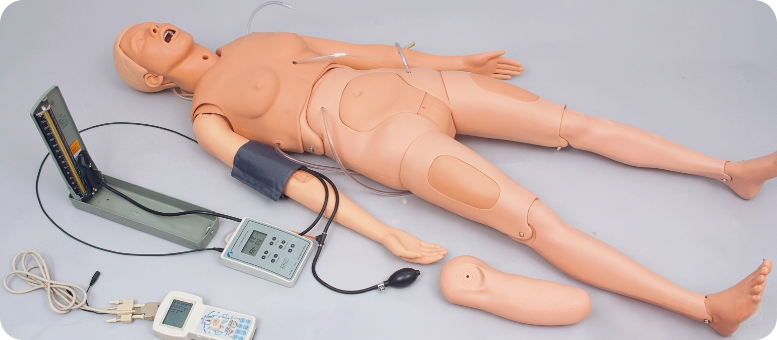 Nursing simulator mannequin with monitoring devices used for clinical training